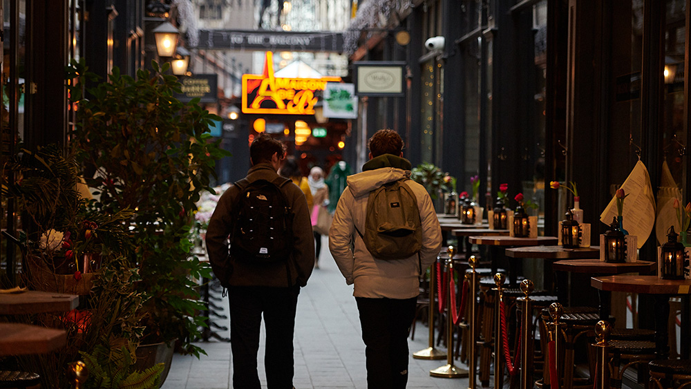 Students walking in arcade