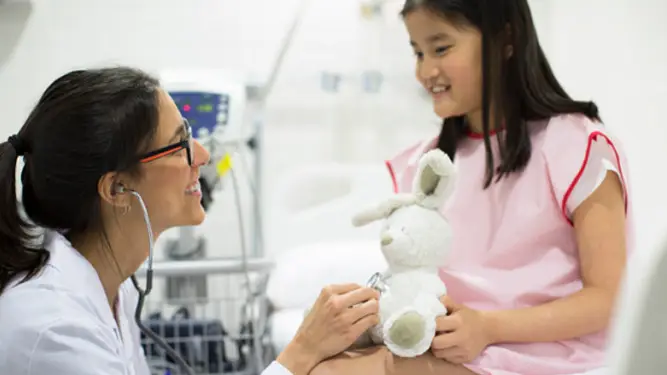 Paediatrician student with child patient